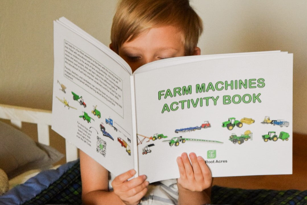 Boy Reading Farm Machines Activity Book